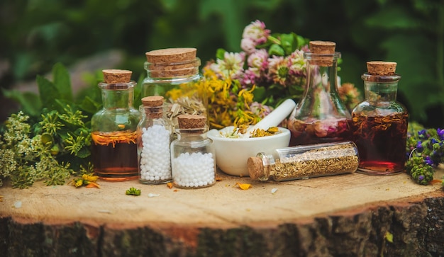 Tincture of medicinal herbs in bottles. Nature.