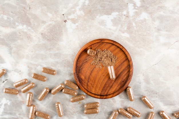 Above view arrangement with pills on marble table