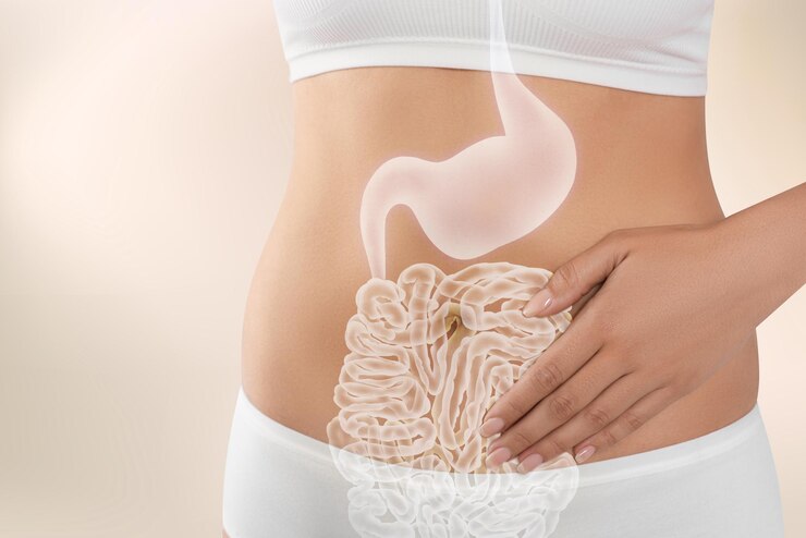 Woman in underwear touching her belly on light background closeup Healthy stomach