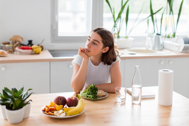 Young woman relaxing in the kitchen