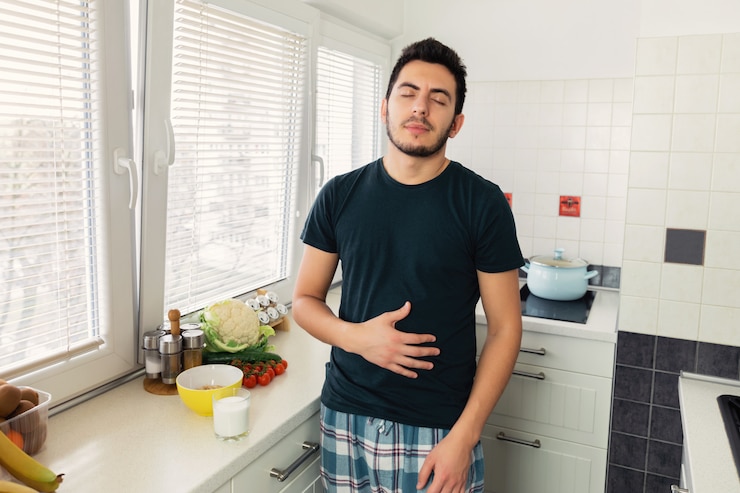 The young man no longer experiences pain and discomfort in the stomach, as he drinks vegetable milk. He has lactose intolerance.